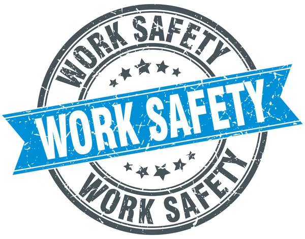 Work safety round grunge ribbon stamp — Stock Vector