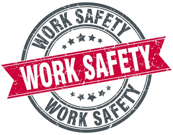 Work safety round grunge ribbon stamp — Stock Vector
