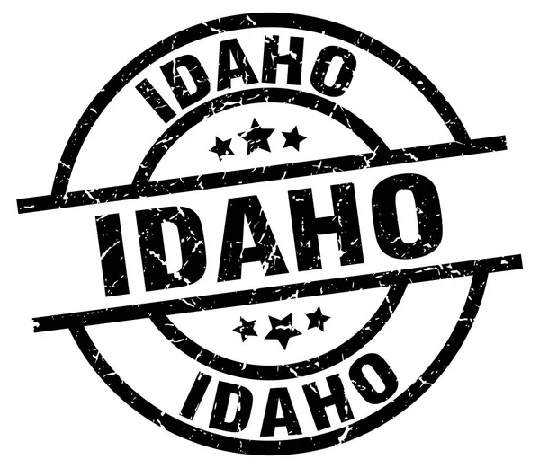 Idaho schwarze runde Grunge-Briefmarke — Stockvektor