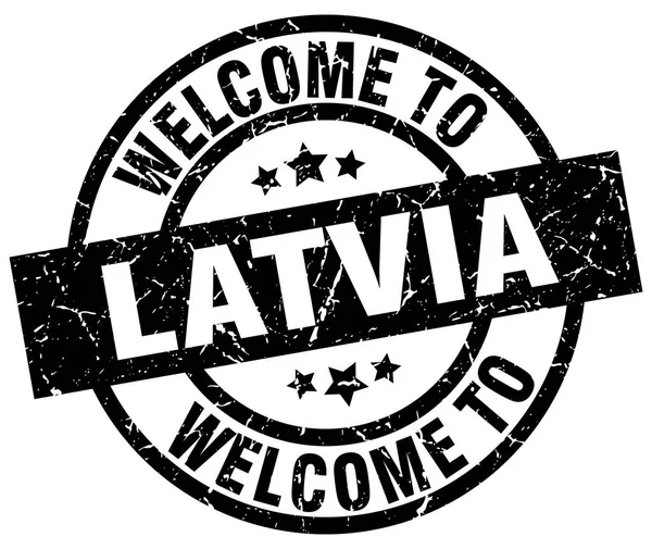 Welcome to Latvia black stamp — Stock Vector