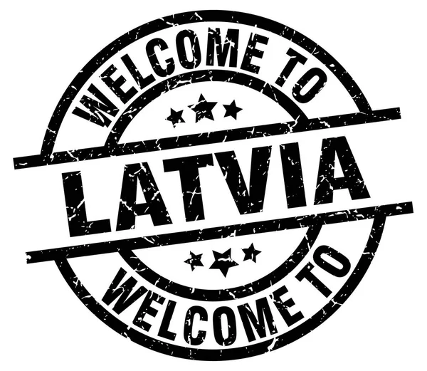 Selamat datang di Latvia stempel hitam - Stok Vektor
