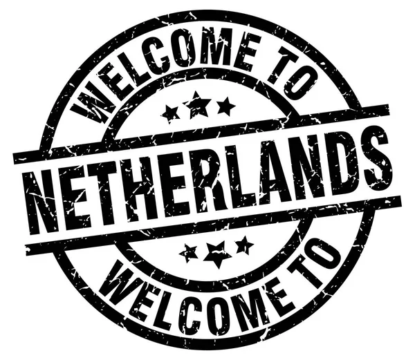 Benvenuto a Paesi Bassi timbro nero — Vettoriale Stock