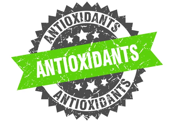 Antioxidantes grunge selo com faixa verde. antioxidantes — Vetor de Stock