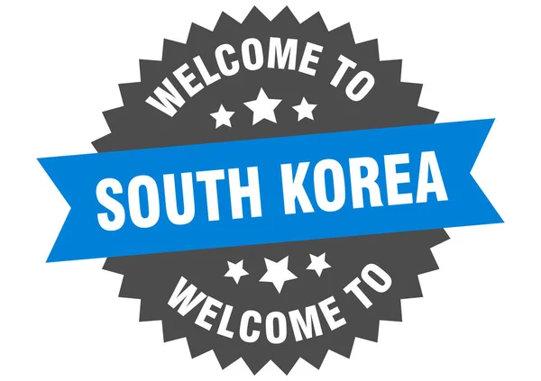 La Corea del Sud firma. Benvenuti a Corea del Sud adesivo blu — Vettoriale Stock