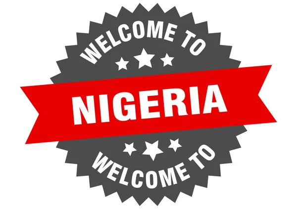 Nigeria firmar. Bienvenido a Nigeria etiqueta roja — Archivo Imágenes Vectoriales