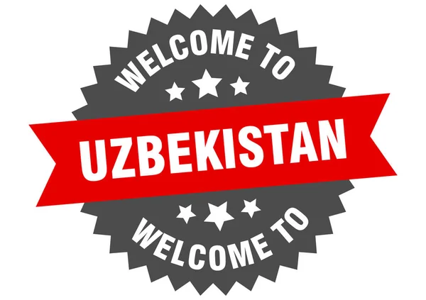Узбекистан подписывает. Добро пожаловать в Узбекистан красный стикер — стоковый вектор