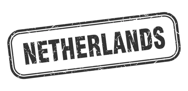 Nederland stempel. Nederland zwart grunge geïsoleerd bord — Stockvector