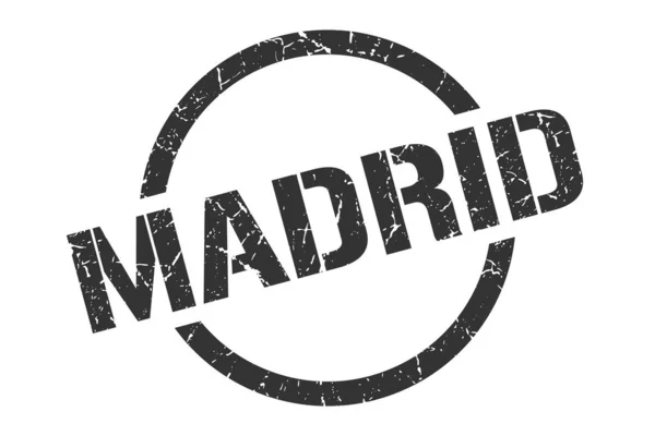 Madrid stamp. Madrid grunge round isolated sign — 스톡 벡터