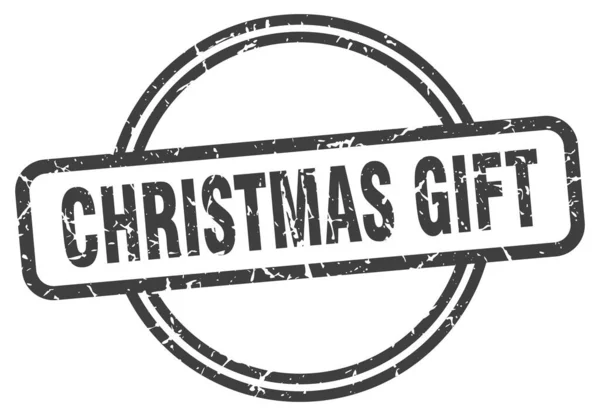Karácsonyi ajándékbélyeg. karácsonyi ajándék kerek vintage grunge jel. karácsonyi ajándék — Stock Vector
