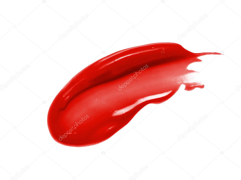 Red lipstick smear smudge swatch isolated on white background. Lip gloss texture. Shiny makeup product swipe sample