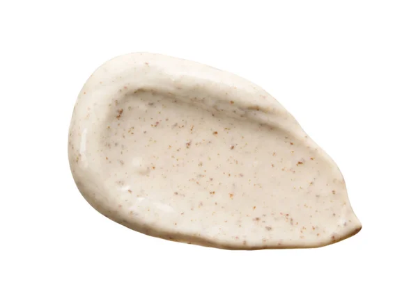 Yüz kremi lekesi beyaza izole edilmiş. Kozmetik cilt bakım ürünü. Bej kahve maskesi örneği yakın plan.