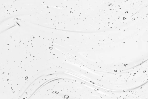 Hyaluronik asit serum dokusu. Güzel cilt bakımı sıvı jel arka planı. Kabarcıklarla kaplanmış temiz kozmetik kremi