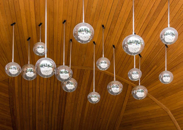 Mirrorballs on wooden ceiling