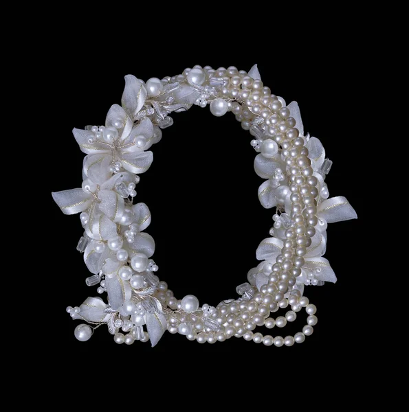 Frame of pearls and flowers on black — Stock Photo, Image