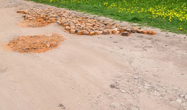 Potholes Rural Dirt Road Covered Broken Bricks Road Repairs — Stock Photo, Image