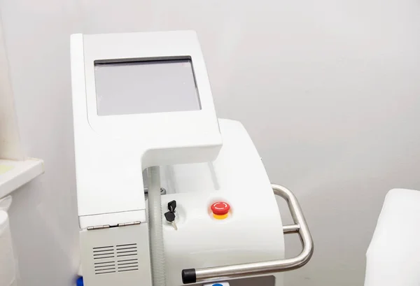 White equipment in a cosmetology cabinet for laser hair removal