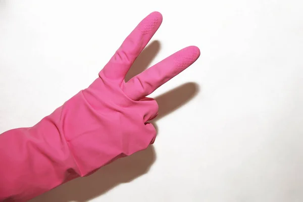 Pink Glove His Right Hand Shows Victory Sign White Background — Stock Photo, Image