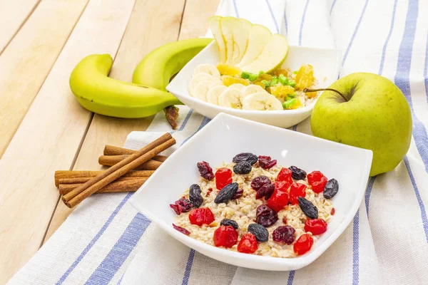 Healthy vegetarian (vegan) breakfast with oatmeal and fruits.