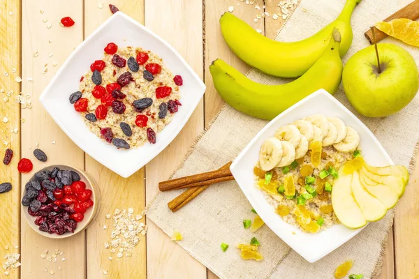 Healthy vegetarian (vegan) breakfast with oatmeal and fruits.
