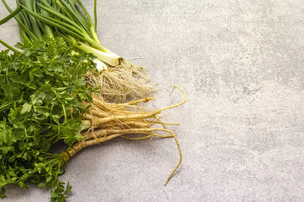 Fresh greens on a stone background — Stock Photo, Image