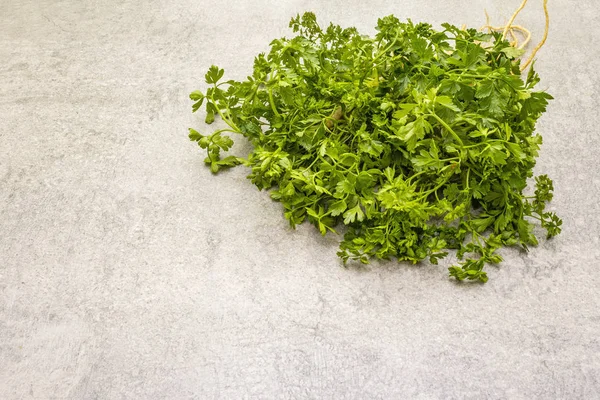 Fresh greens on a stone background — Stock Photo, Image