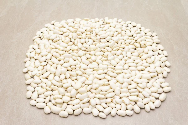 Dry lima beans. On a stone background. — Stock Photo, Image