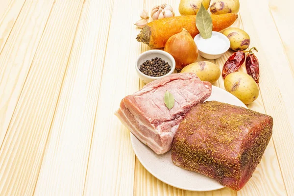 Ingredients for meat stew with potatoes and vegetables. Raw pork fillet, brisket, spices on a stone background. — Stock Photo, Image