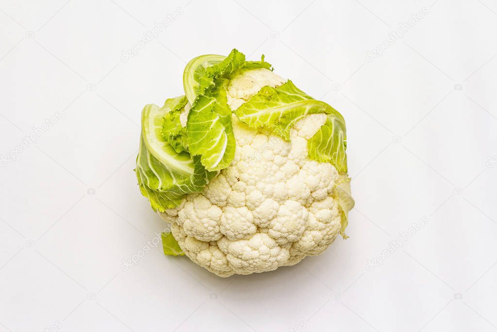 Ripe single cauliflower. Fresh whole head of cabbage, green leaves. Isolated on white background