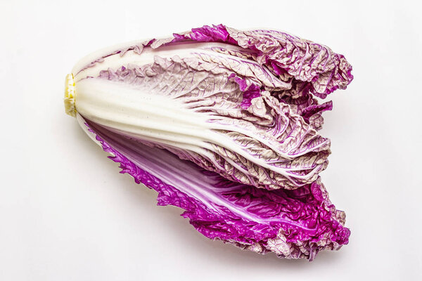 Ripe single purple Napa (chinese) cabbage. Fresh whole head of cabbage. Isolated on white background
