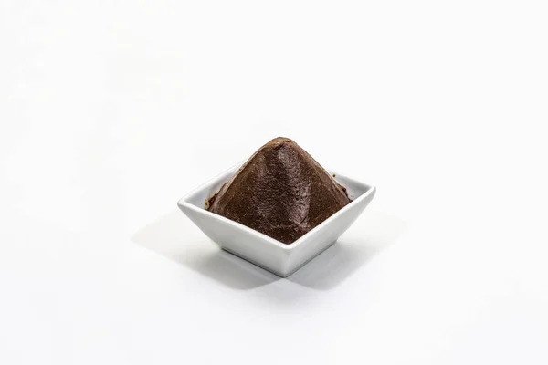 Dark brown miso paste isolated on white background. Traditional Japanese seasoning, indispensable ingredient for cooking soup stock — Stock Photo, Image