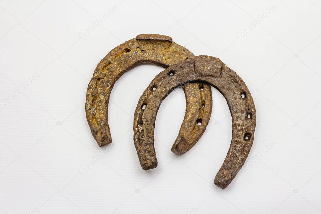 Cast iron metal horse horseshoes isolated on white background. Good luck symbol, St.Patrick's Day concept, horse accessories. Template, mockup