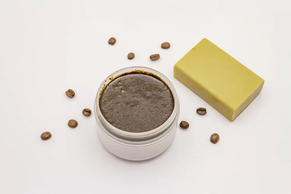 Coffee body scrub and soap isolated on white background. Spa concept, homemade cosmetics from natural ingredient
