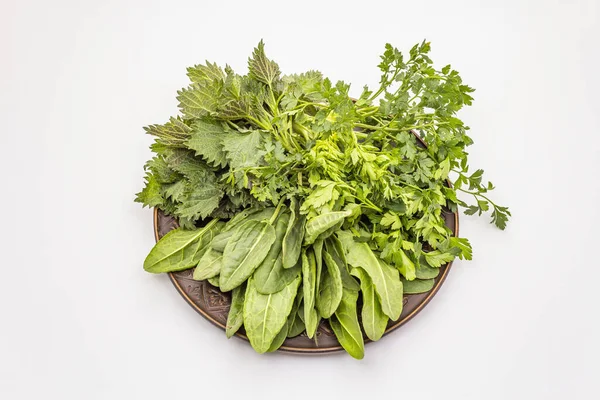 Fresh greens set isolated on white background. Nettle, sorrel, parsley. Traditional ingredients for spring soup — Stock Image Fresh Greens Set Isolated White Background Nettle Sorrel Parsley Traditional Royalty Free Stock Photos