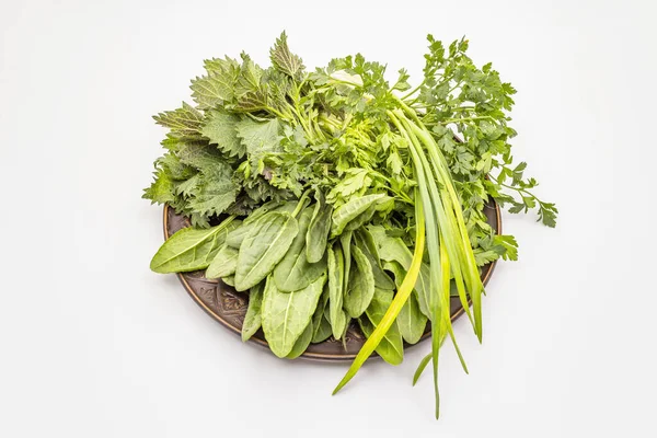 Fresh greens set isolated on white background. Nettle, sorrel, parsley, garlic. Traditional ingredients for spring soup — Stock Image Fresh Greens Set Isolated White Background Nettle Sorrel Parsley Garlic Stock Picture