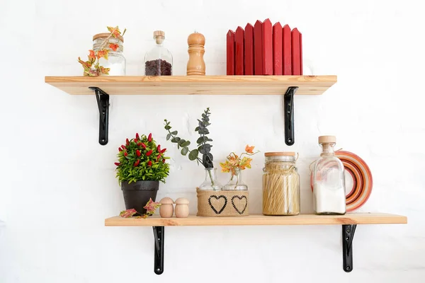 kitchen shelfs with spices, autumn white interior