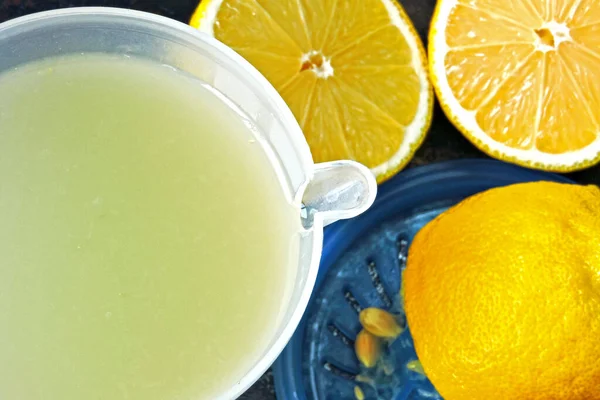 Lemon fresh and lemons. Citrus juice extractor. The concept of weight loss with lemon juice.