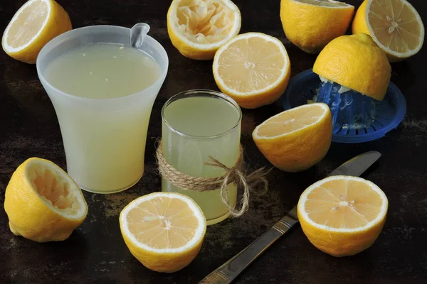 Lemon fresh and lemons. Citrus juice extractor. The concept of weight loss with lemon juice.