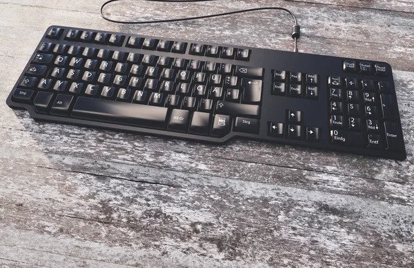 PC-Tastatur auf einem Tisch mit abgenutztem Naturholz - 3D-Rendering — Stockfoto