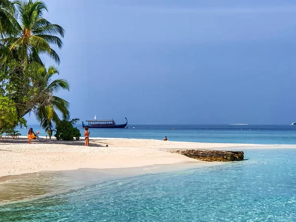 People on holiday on the white spies of the Maldives