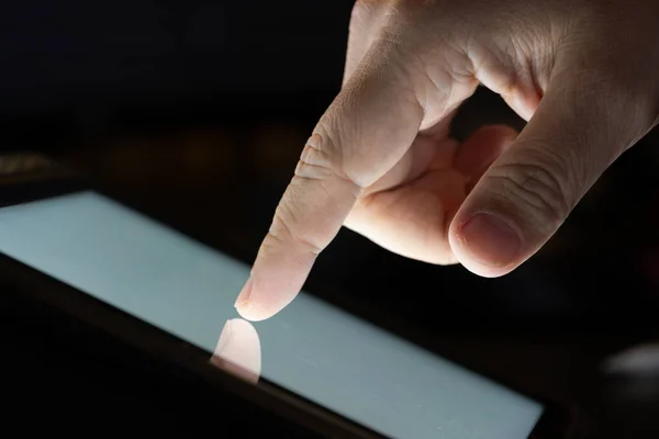 Finger touch on Tablet screen Mock up with light. Concept for mobile phone technology and device.