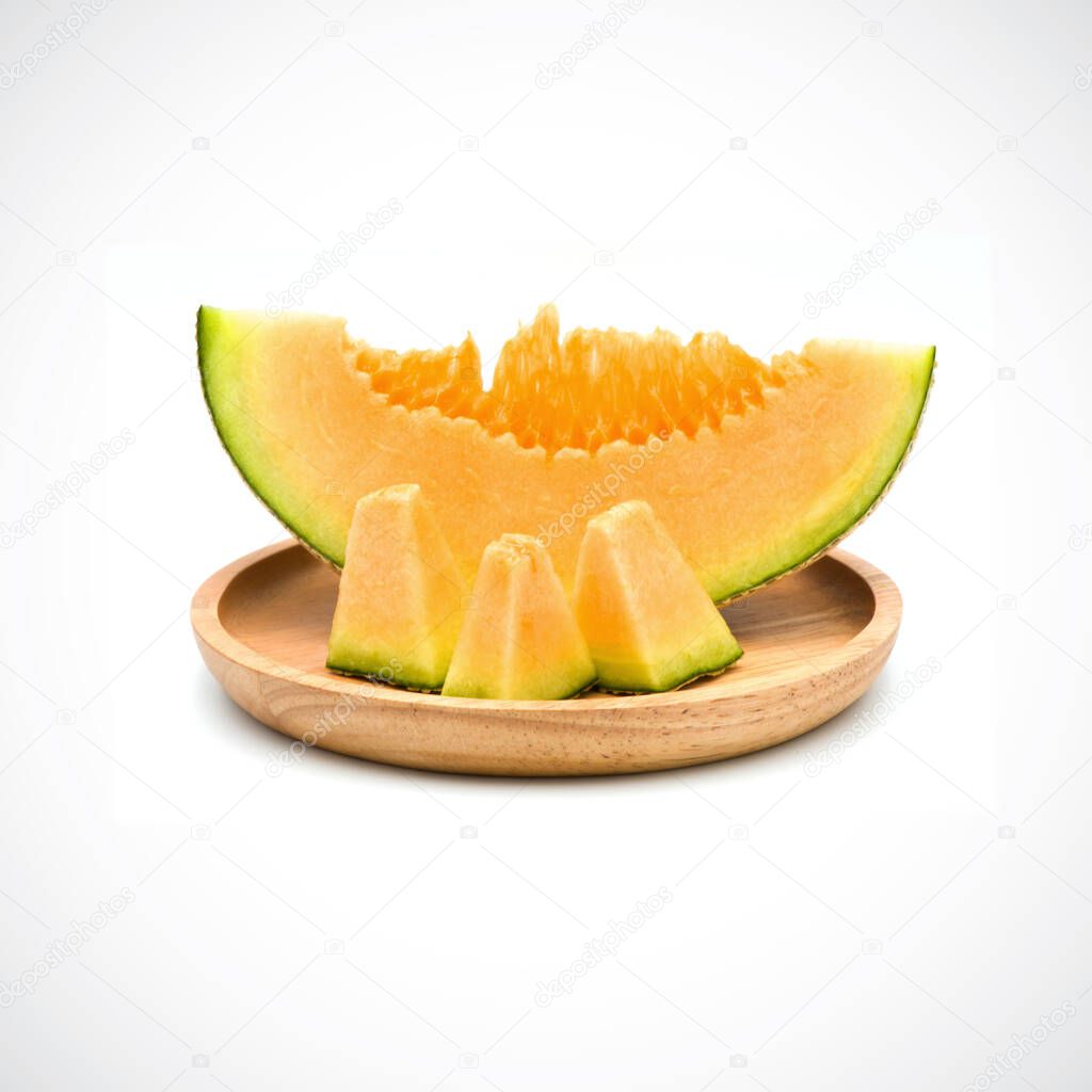 Cantaloupe Melon, In a wooden plate with Orange flesh on the Whi