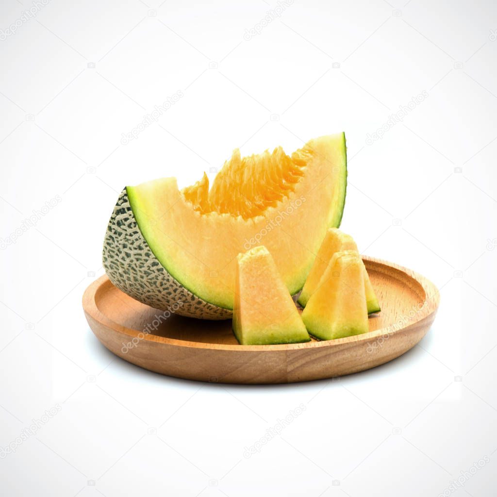 Cantaloupe Melon, In a wooden plate with Orange flesh on the Whi