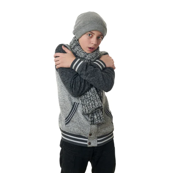 Bonito adolescente menino em camisola cinza sobre fundo isolado branco — Fotografia de Stock