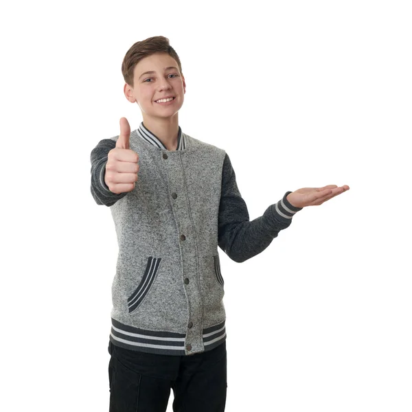 Niedlicher Teenager Junge in grauem Pullover über weißem isoliertem Hintergrund — Stockfoto