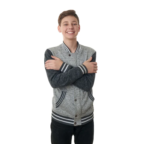 Söt tonåring pojke i grå tröja över vit isolerade bakgrund — Stockfoto