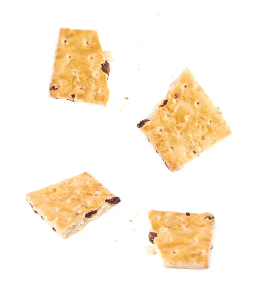 Broken into pieces cookie isolated over the white background — Stock Photo, Image