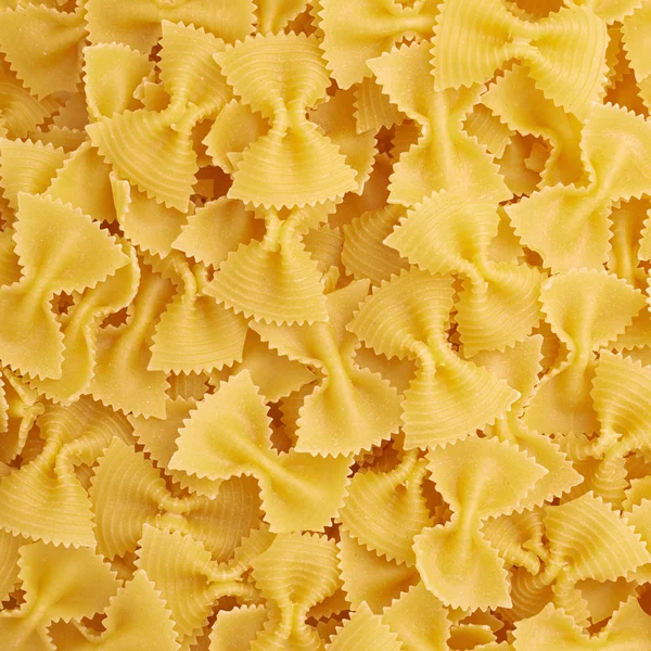 Куча фарфоровой желтой пасты в качестве абстрактного фона — стоковое фото