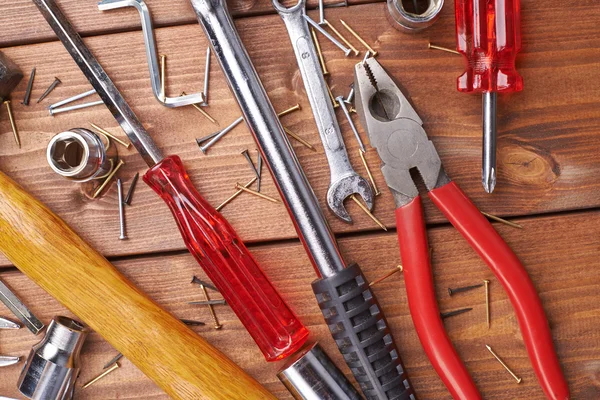 Set of different work tools on wooden surface — Stock Photo, Image