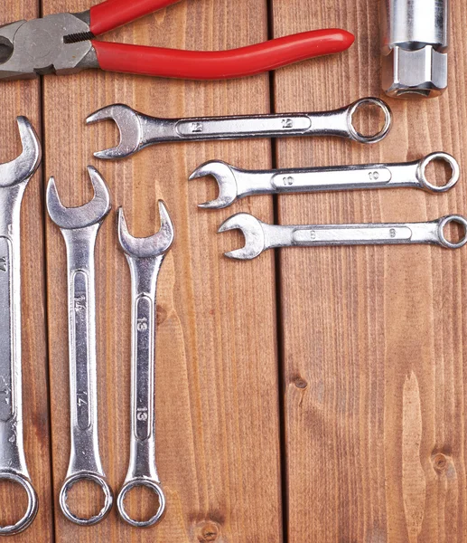 Set of different work tools on wooden surface — Stock Photo, Image