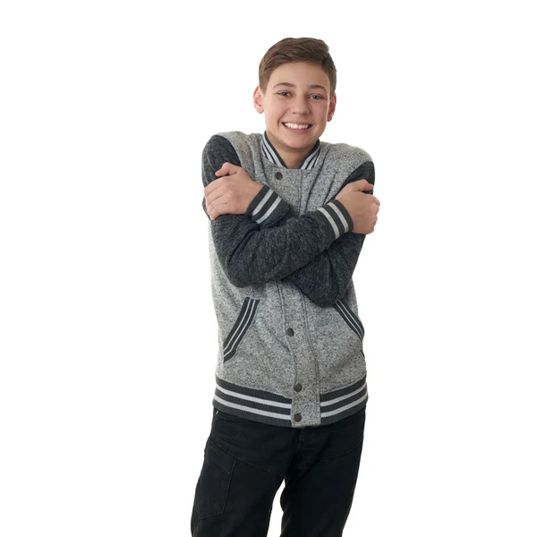 Söt tonåring pojke i grå tröja över vit isolerade bakgrund — Stockfoto